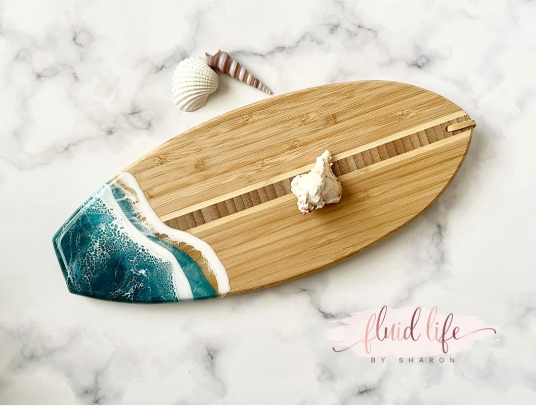 Surfboard shape cutting board